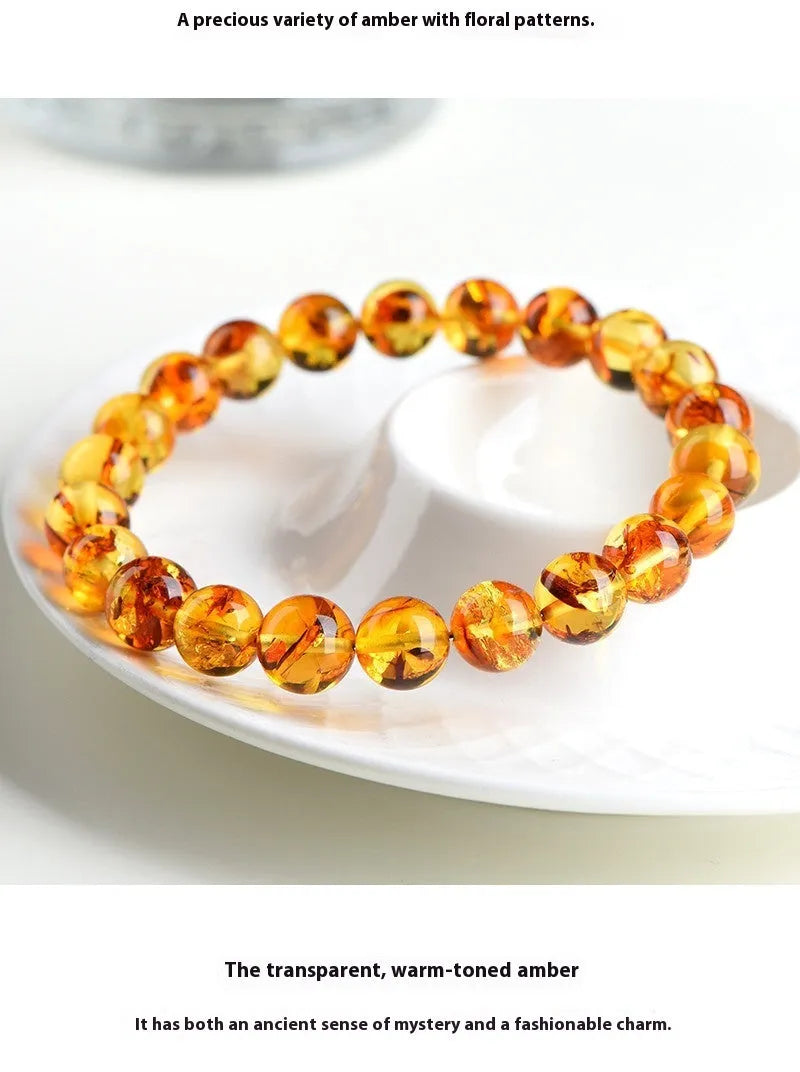 A natural yellow piebald amber bracelet with geometric beads for water purification.