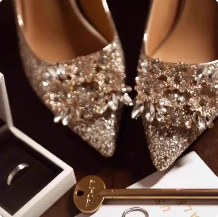 Champagne coloured pointed toe bridal shoes with rhinestone decoration and fine heel