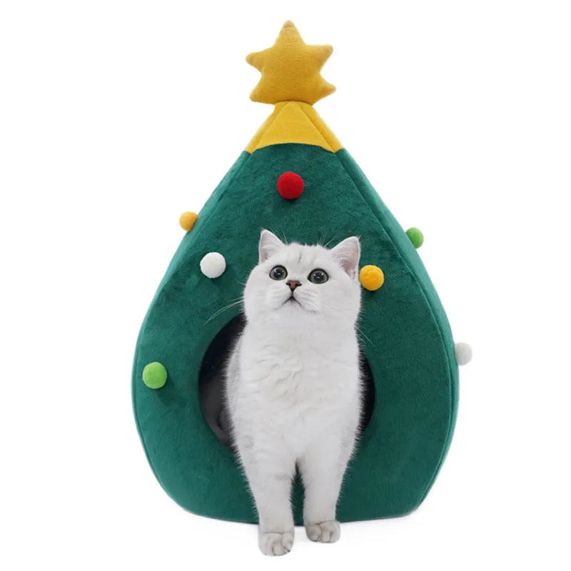 Red Christmas tree shaped plush cave bed for a cat or small dog on a wooden floor