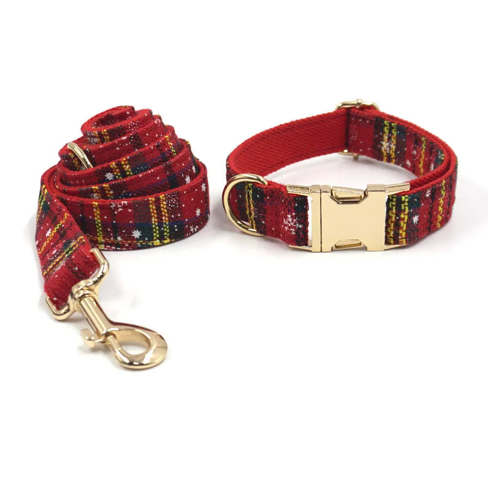 Red cloth Christmas dog collar and lead set with matching chest strap, bow, and waste bag.