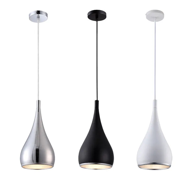 Minimalist iron pendant chandelier with three black lamp heads on a long disc fitting.