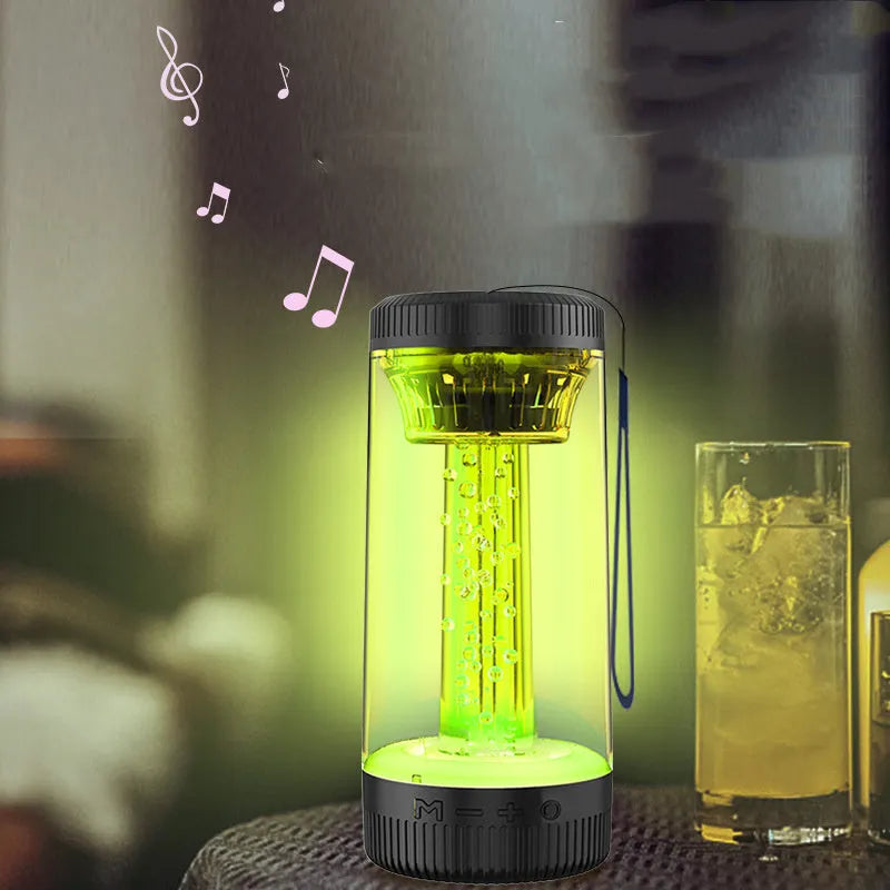 Black outdoor portable camping light Bluetooth speaker with LED colourful light on a natural background