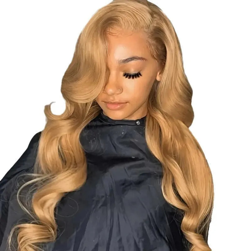 Long light brown curly wig with golden big waves and side bangs on a mannequin head.