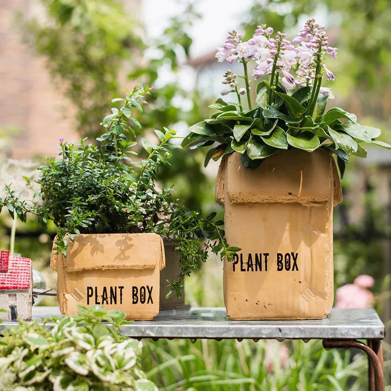 Cement brown paper box style flowerpot with drainage holes for indoor plants
