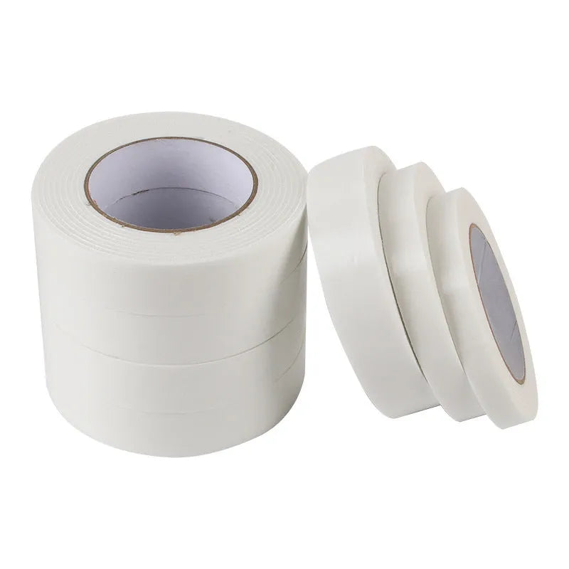Roll of white foam double-sided adhesive tape showing its 3mm thickness and strong adhesive.