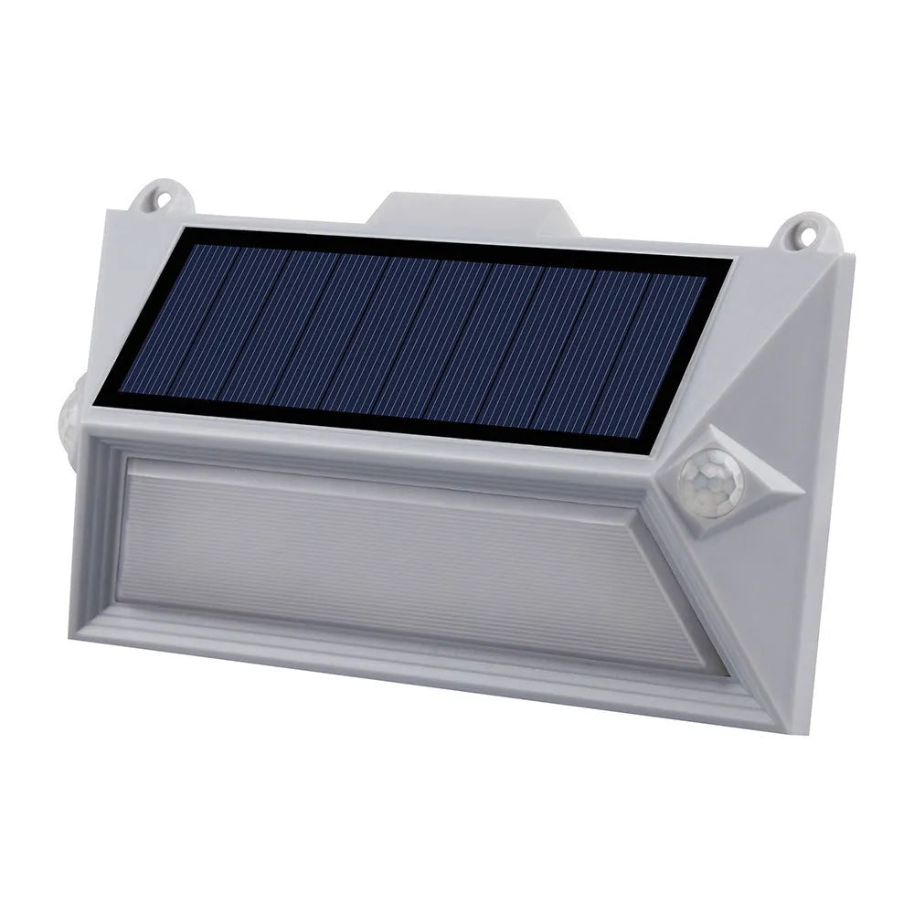 Solar-powered outdoor motion sensor step light in an abstract design.
