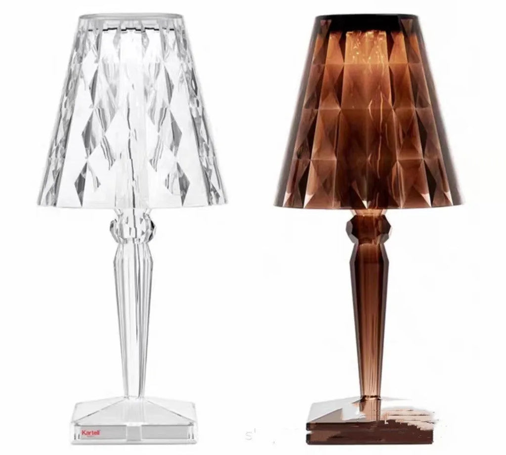 Rose gold plated portable touch night light with acrylic body on a surface.