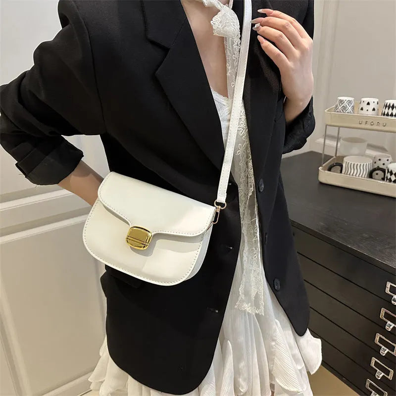 Simple PU leather women's handbag showing interior zipper coin compartment and phone pocket.