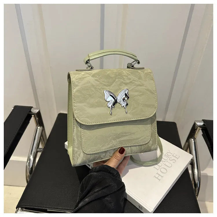Women's preppy style PU synthetic leather backpack with bow detailing in six colour options