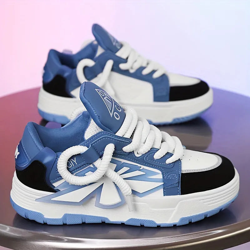 Men's white chunky sneakers with thick rubber sole and synthetic leather upper on a casual background.