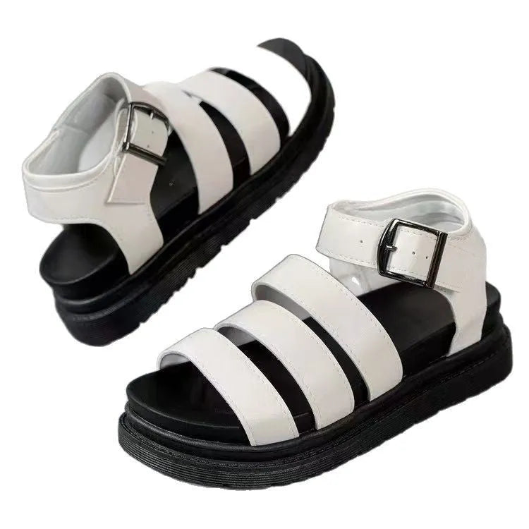 Black thick-soled beach sandals with an adjustable buckle strap and round toe fish mouth design.
