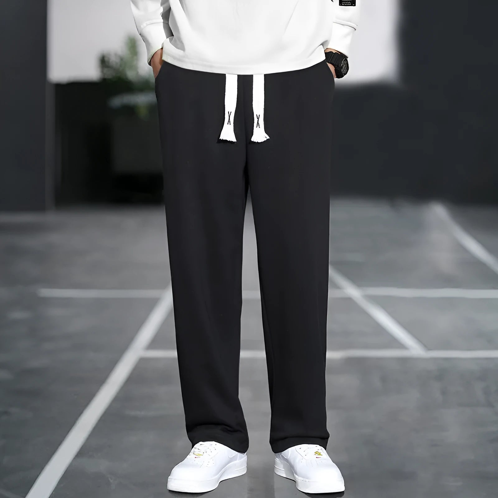 Men's grey Ninth Sports Pants showing high waist and multiple pockets.