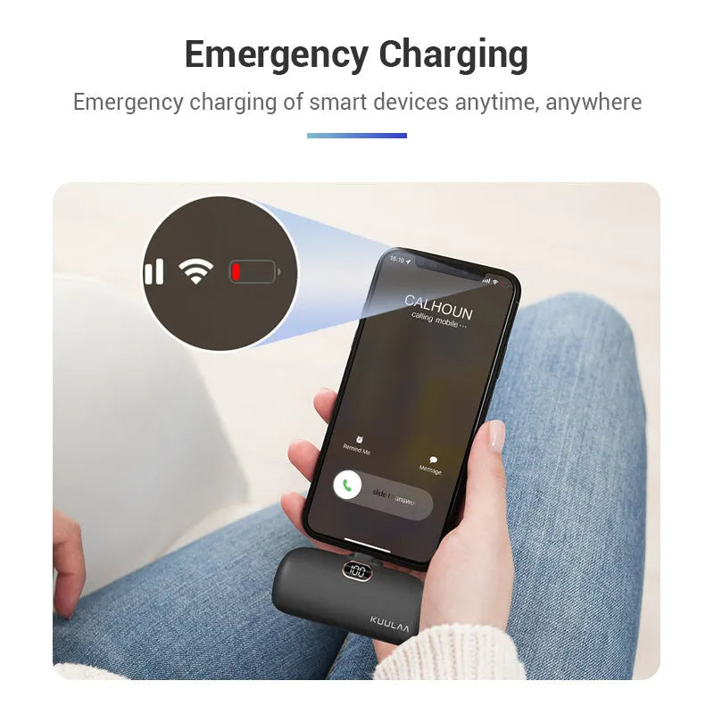 Compact cylindrical alloy power bank with built-in charging cable and LCD digital display.