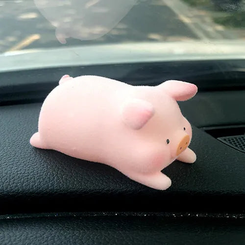 Cute cartoon pig resin figurine car dashboard ornament in one of eight available styles.