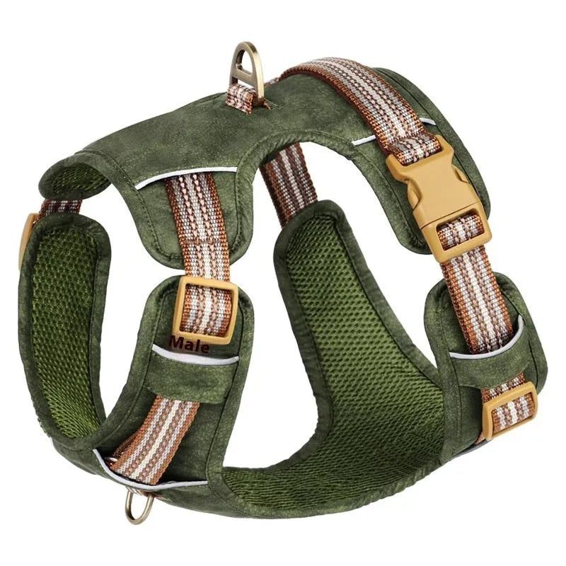Brown leather dog harness with reflective strips and chest clip.