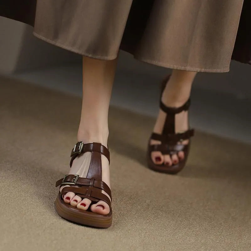 Black women's retro sandals with a T-buckle strap, chunky platform heel, and open square toe