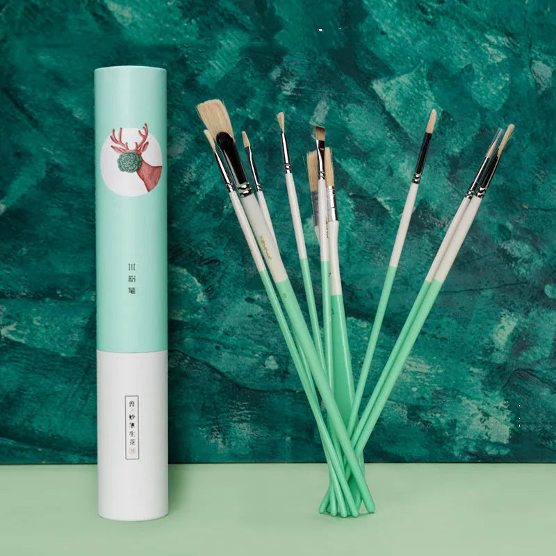Acrylic gouache painting brush set with fan brushes, liner, and corner tools in animal designs on a table
