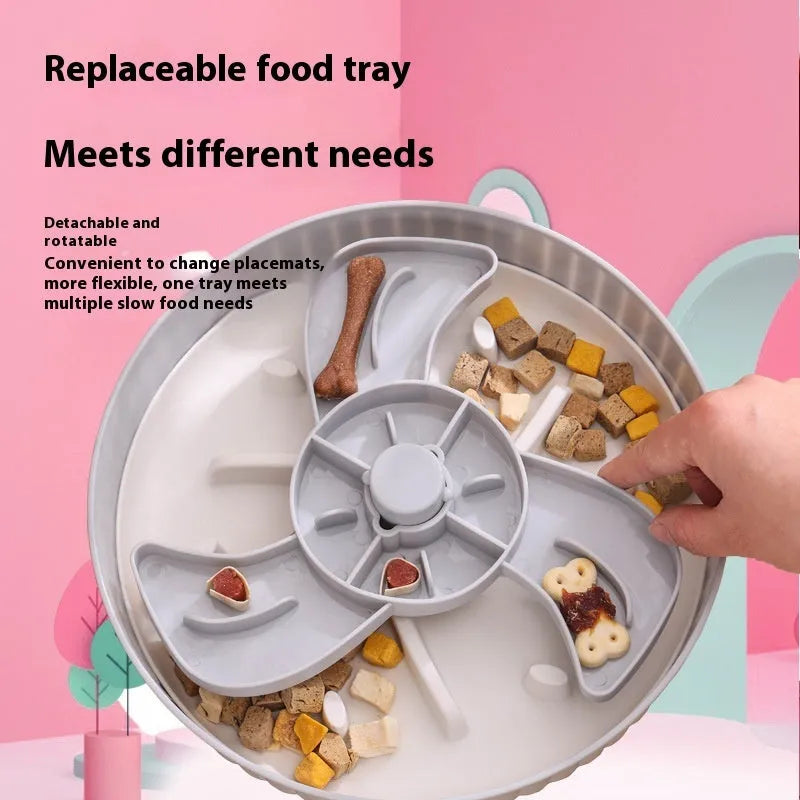 Grey interactive pet slow feeder bowl with rotating centre holding a green silicone licking mat on a kitchen floor.