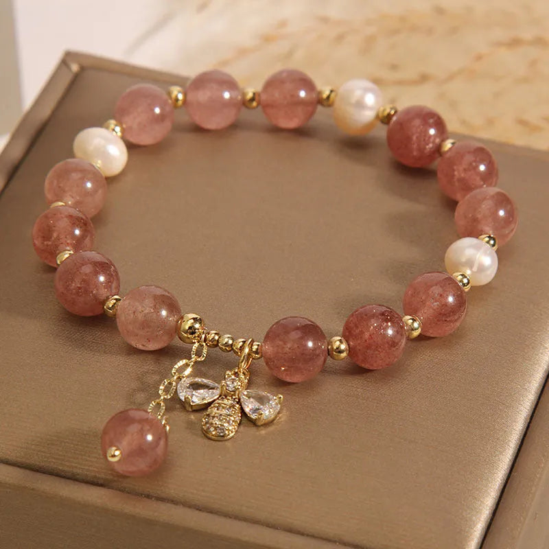Women's bracelet with strawberry quartz beads, freshwater pearls, zircon details and an alloy clasp