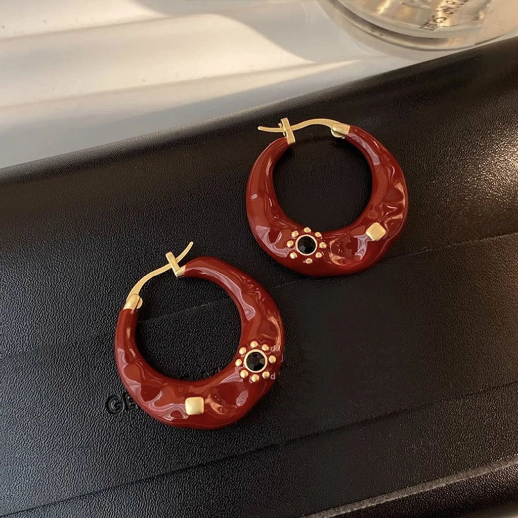 Hong Kong style retro ear studs with dripping oil texture and rhinestone decoration in black or red colour options