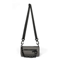 Black Oxford cloth messenger bag with a chain detail, worn crossbody.