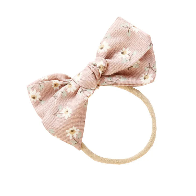 Children's cloth knotted bow hair ring in a Snow White princess design.