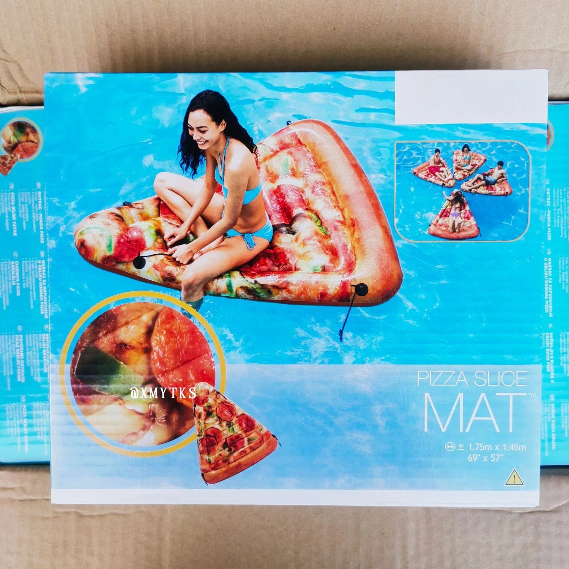 Large green and red pizza themed inflatable surfboard float on water