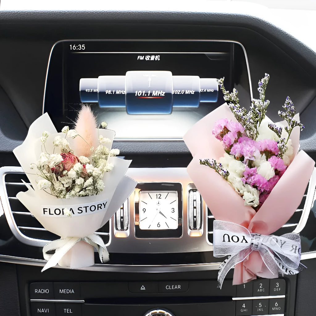 Mini dried flower bouquet clipped onto a car air vent, showing pink and white floral style.