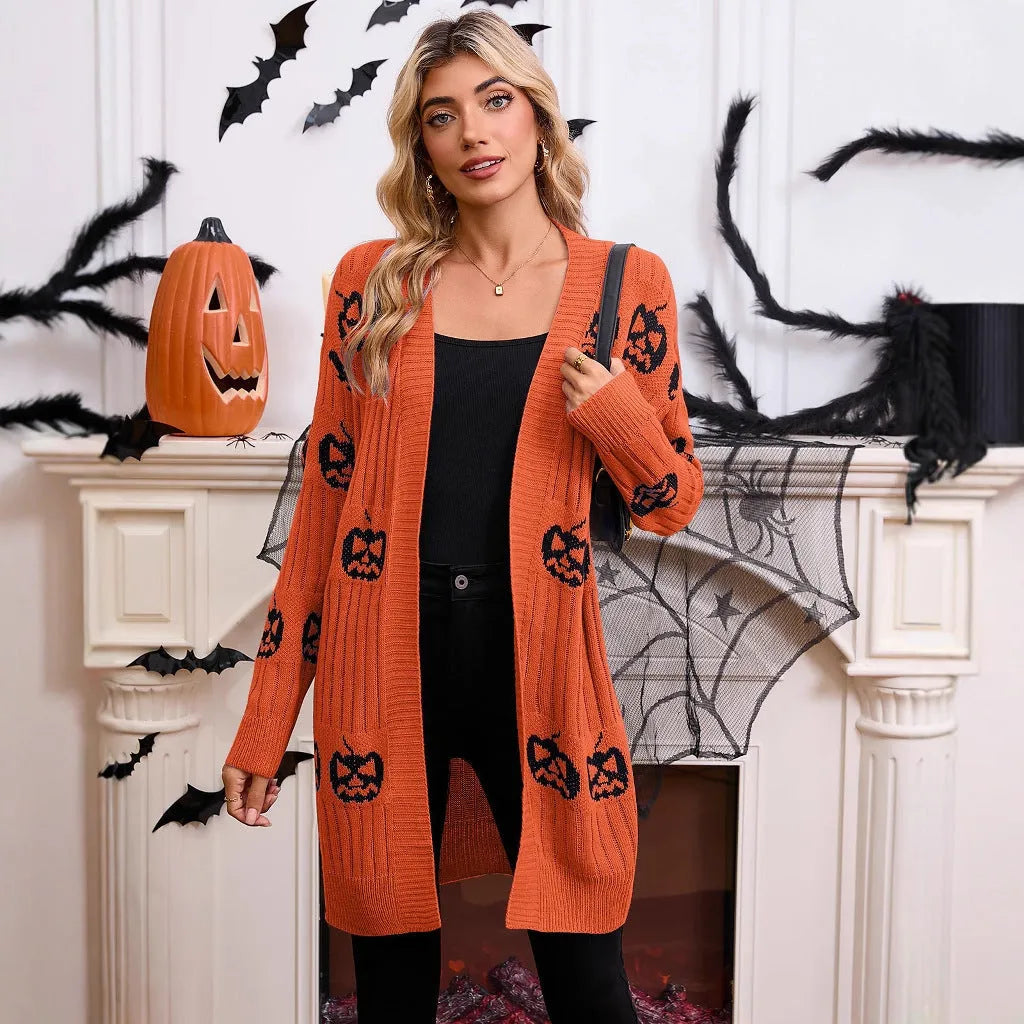 Women's black cardigan with orange pumpkin head jacquard pattern, open front, regular sleeves.