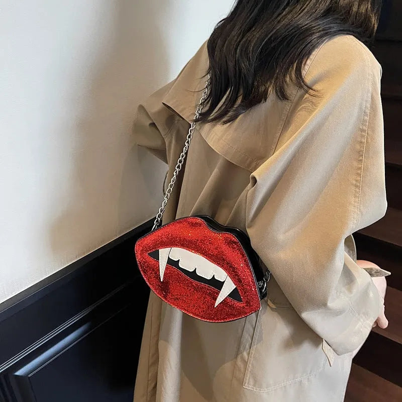 Small red PU sequin crossbody bag with chain detail, oval hard shape, front view on plain background
