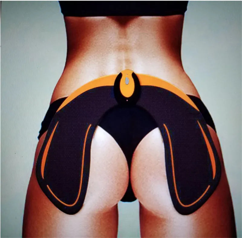 Compact EMS hip muscle training stimulator device with adhesive gel pads for buttocks and abdomen.