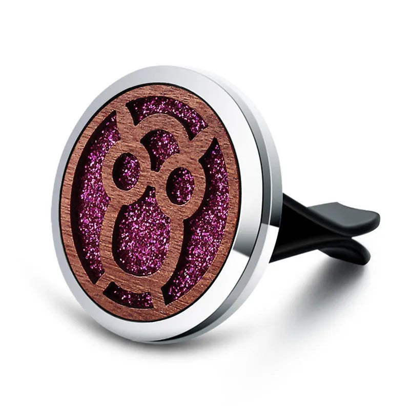Round car vent aromatherapy clip in alloy wood construction showing hollow centre for incense
