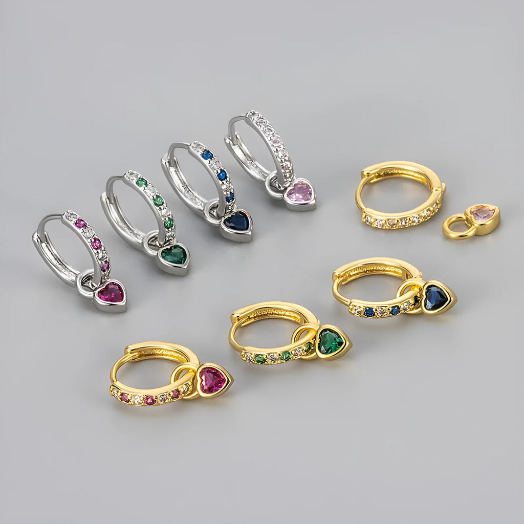 Gold-coloured clip-on earring for women with a heart-shaped drop featuring a pink zircon stone.