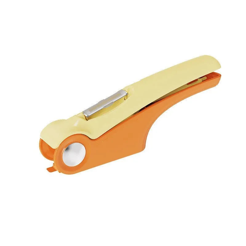 Manual garlic press with stainless steel component and coloured ABS handle measuring 22cm