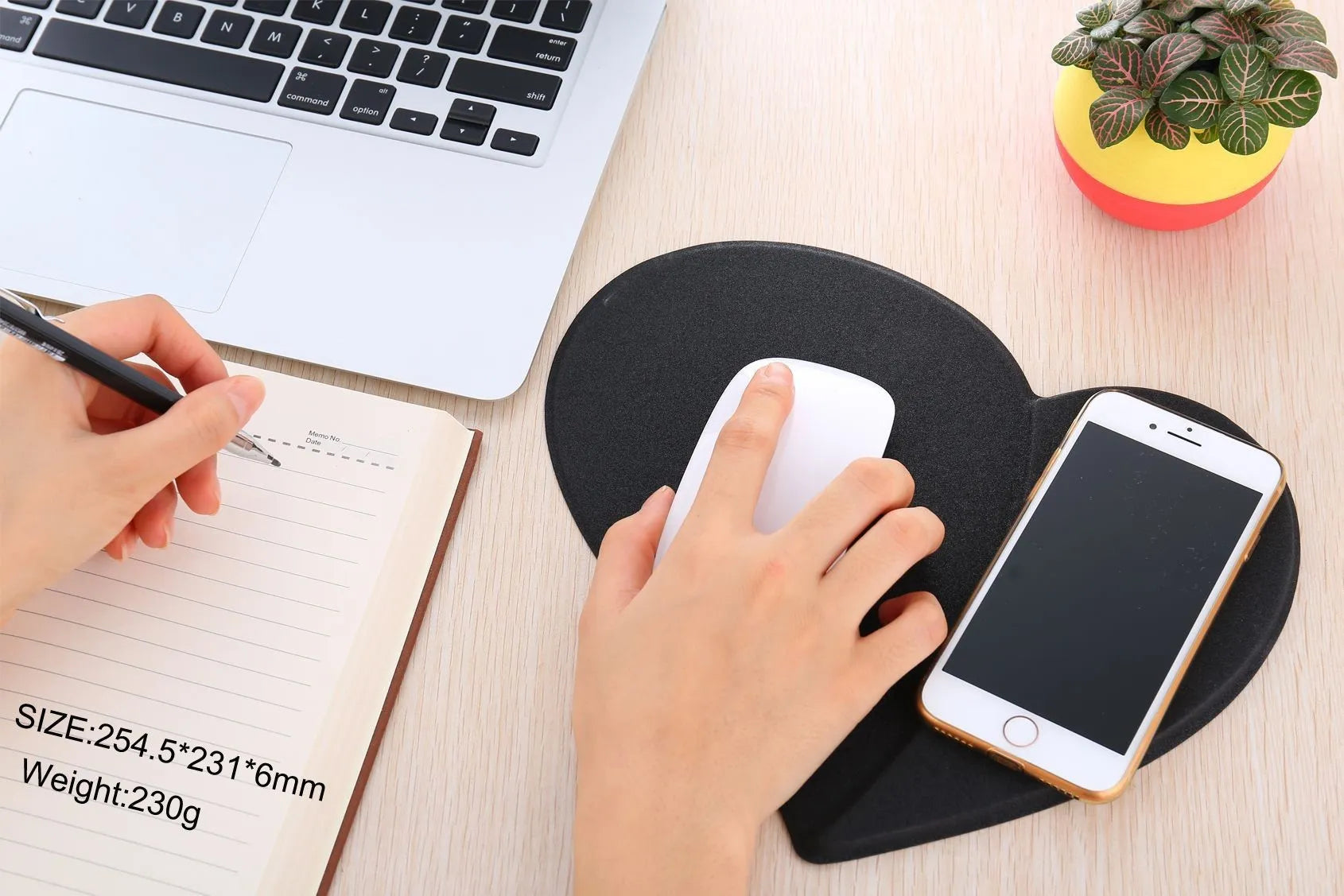 Heart shaped red leather wireless charging mouse pad with indicator light on a desk
