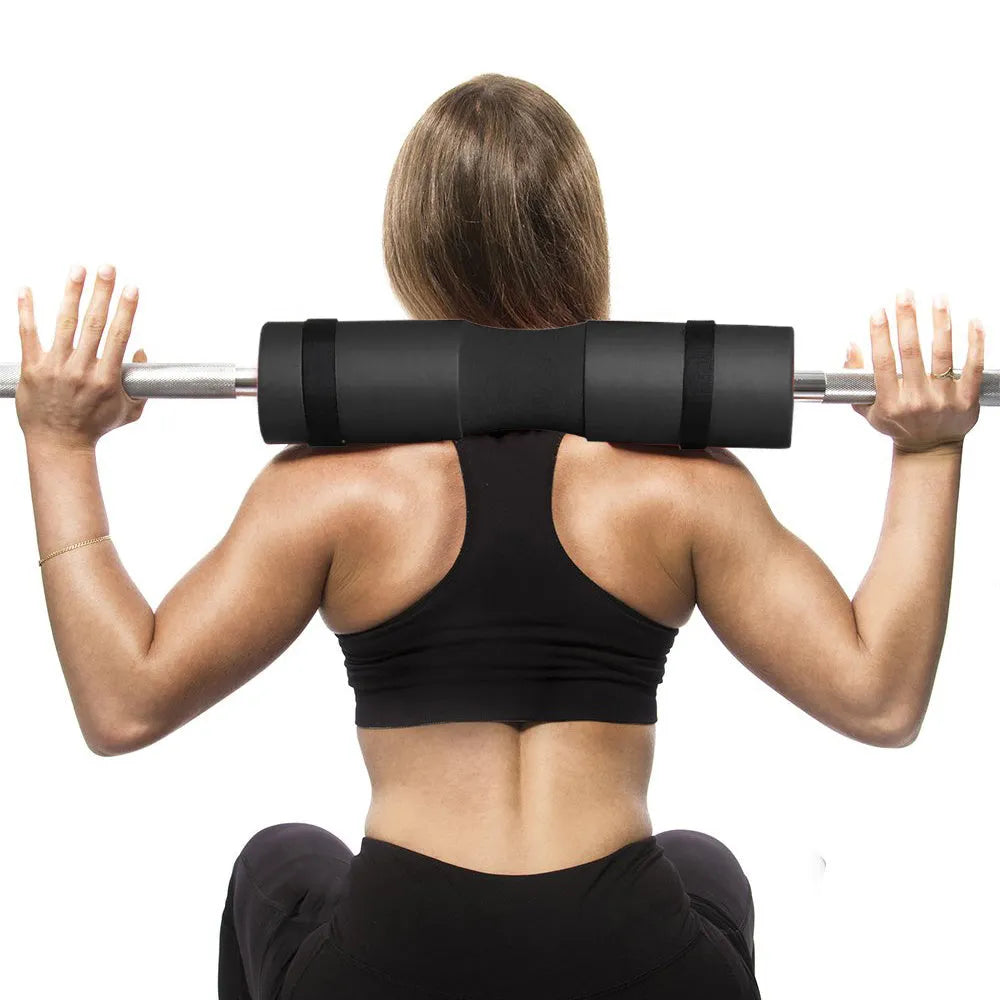 Red foam barbell pad cover for squats, 45cm length, with straps, on a barbell