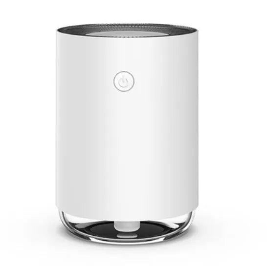 White, pink, or green night light humidifier and essential oil diffuser unit on a bedside table