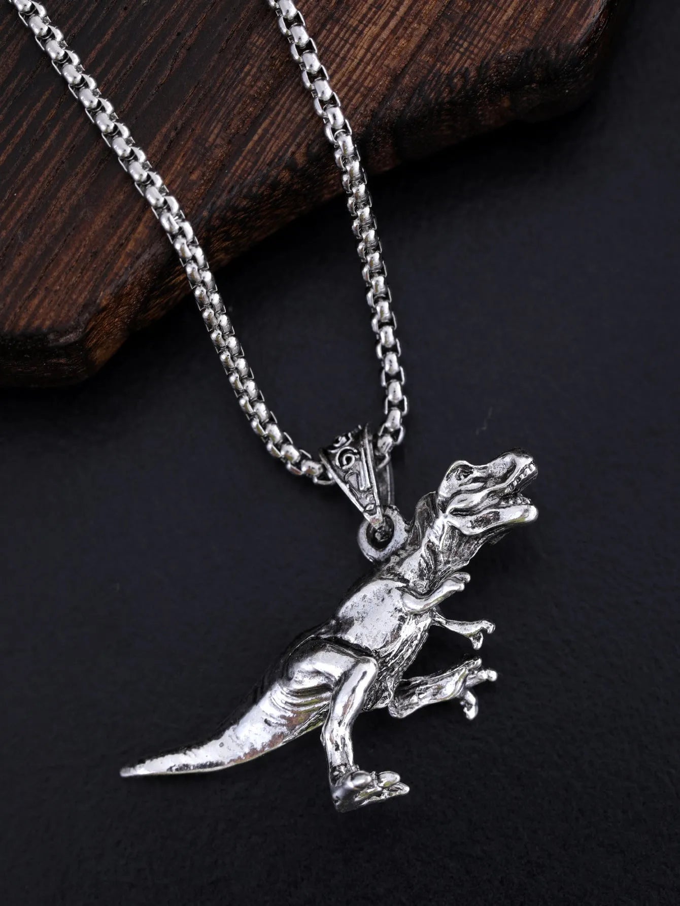 New Hip Hop Style Titanium Dinosaur Pendant necklace on display