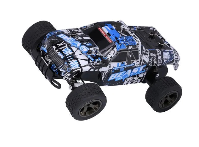 Blue 1:18 scale remote control off-road drift car with 2.4GHz remote on a grey surface.