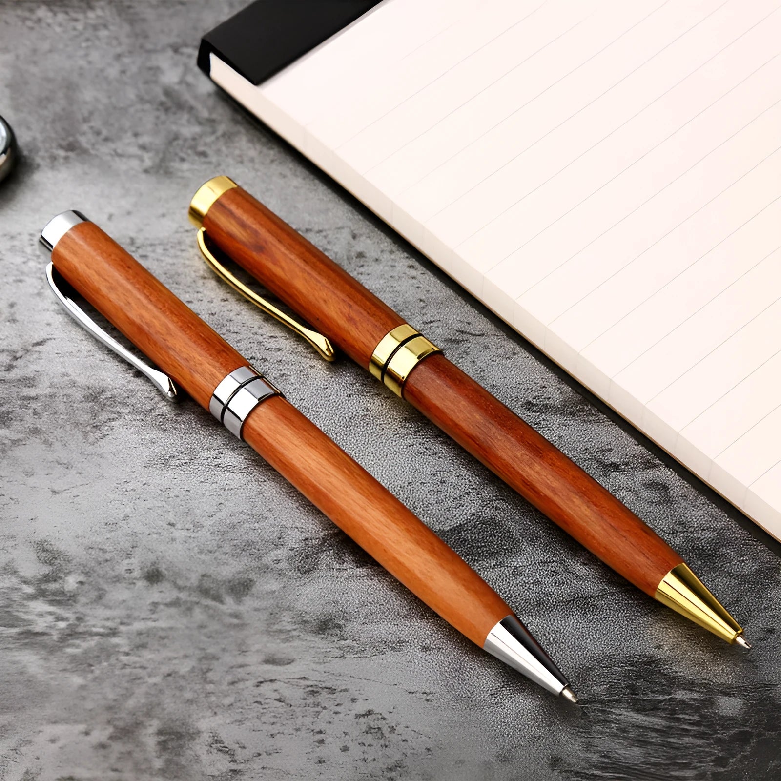 Rosewood and metal ballpoint pen 14cm long with gold and silver finish options on a white background