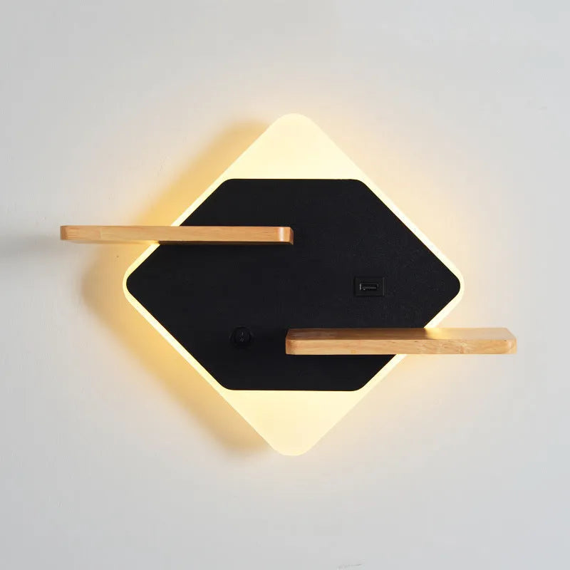 Black round bedside lamp with USB charging port on a wooden nightstand.