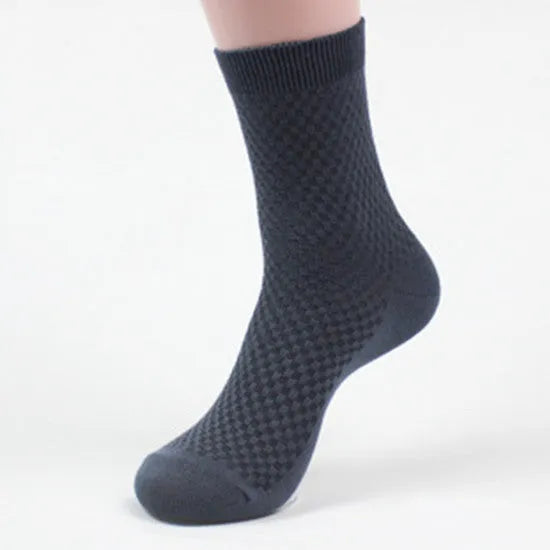 Men's bamboo fibre socks in black, navy, silver, iron grey, and grey blue with small square pattern.