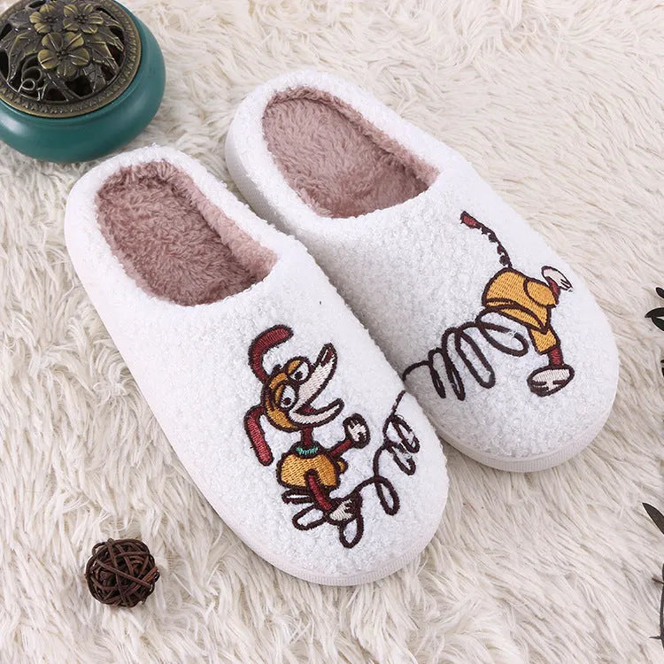 White cartoon pattern fluffy slippers with a non-slip rubber sole and toe holder design.