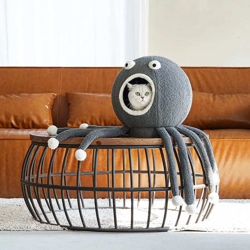Plush octopus‑shaped cat nest in octopus colour, 40x40x42 cm, with raised eyes and soft cloth surface.