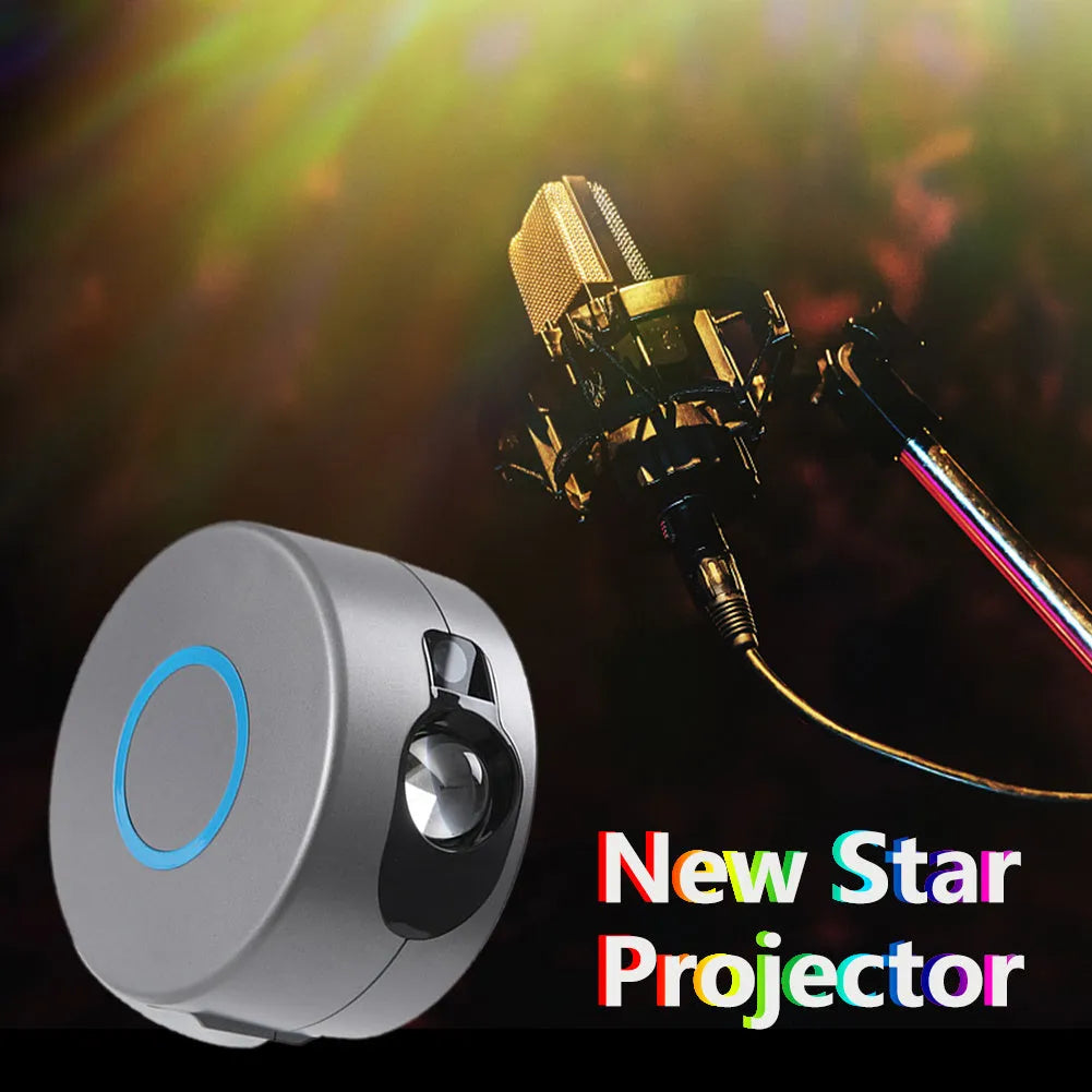 Grey starry sky projection lamp with remote control projecting coloured stars and green laser light indoors.