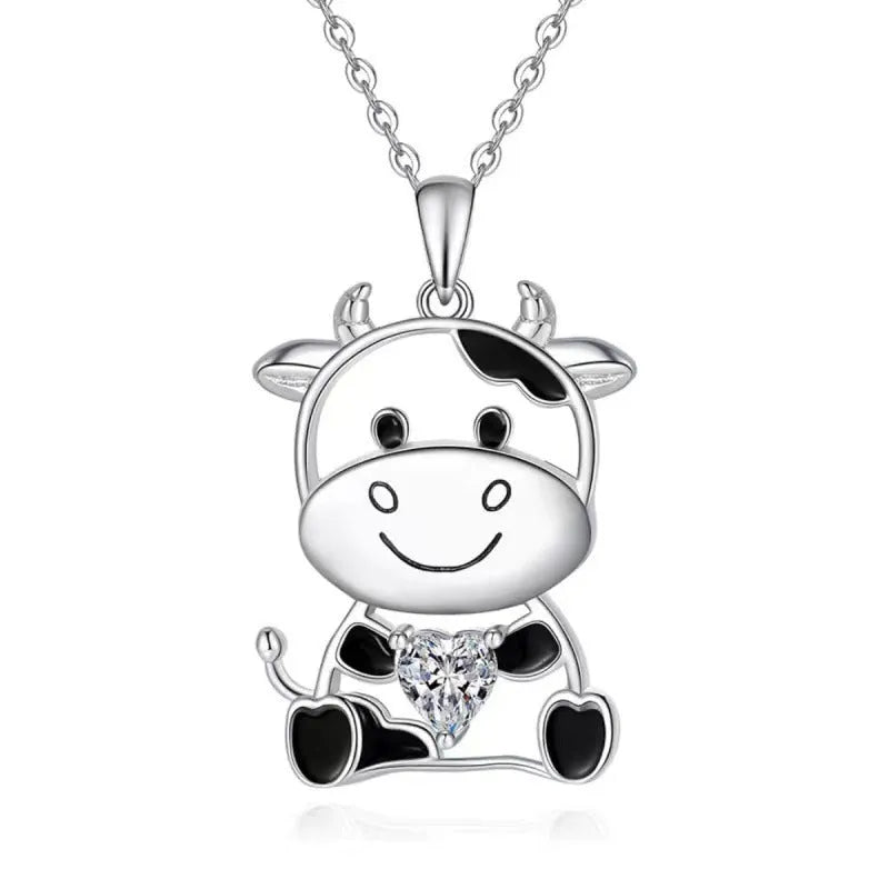 Silver alloy children's necklace with cartoon cow pendant and heart-shaped gem on O-shaped chain