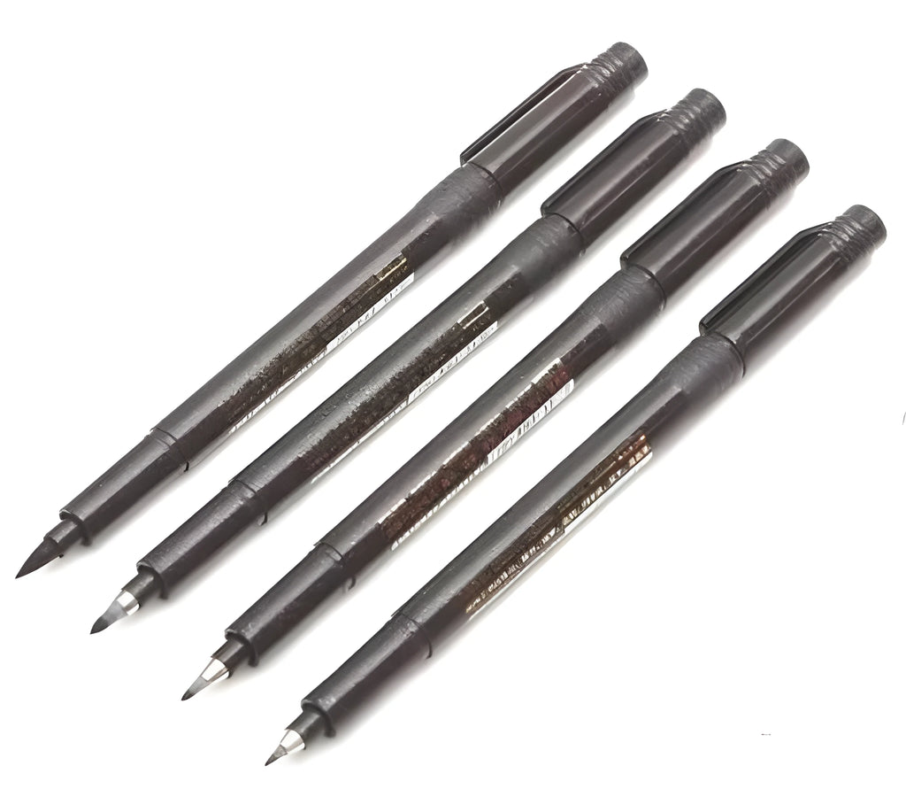Set of 4 black calligraphy felt tip pens with ink refill bottles on a white surface