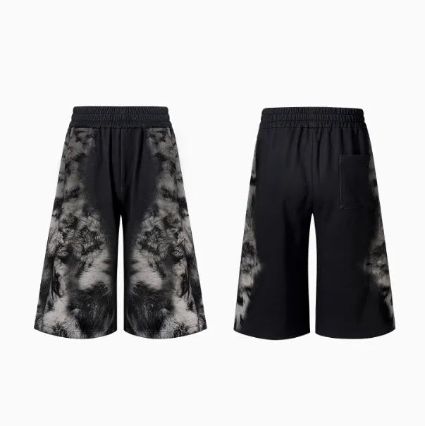 Streetwear co-ord set featuring printed loose trousers, a matching hoodie, and seven-inch shorts on a neutral background.