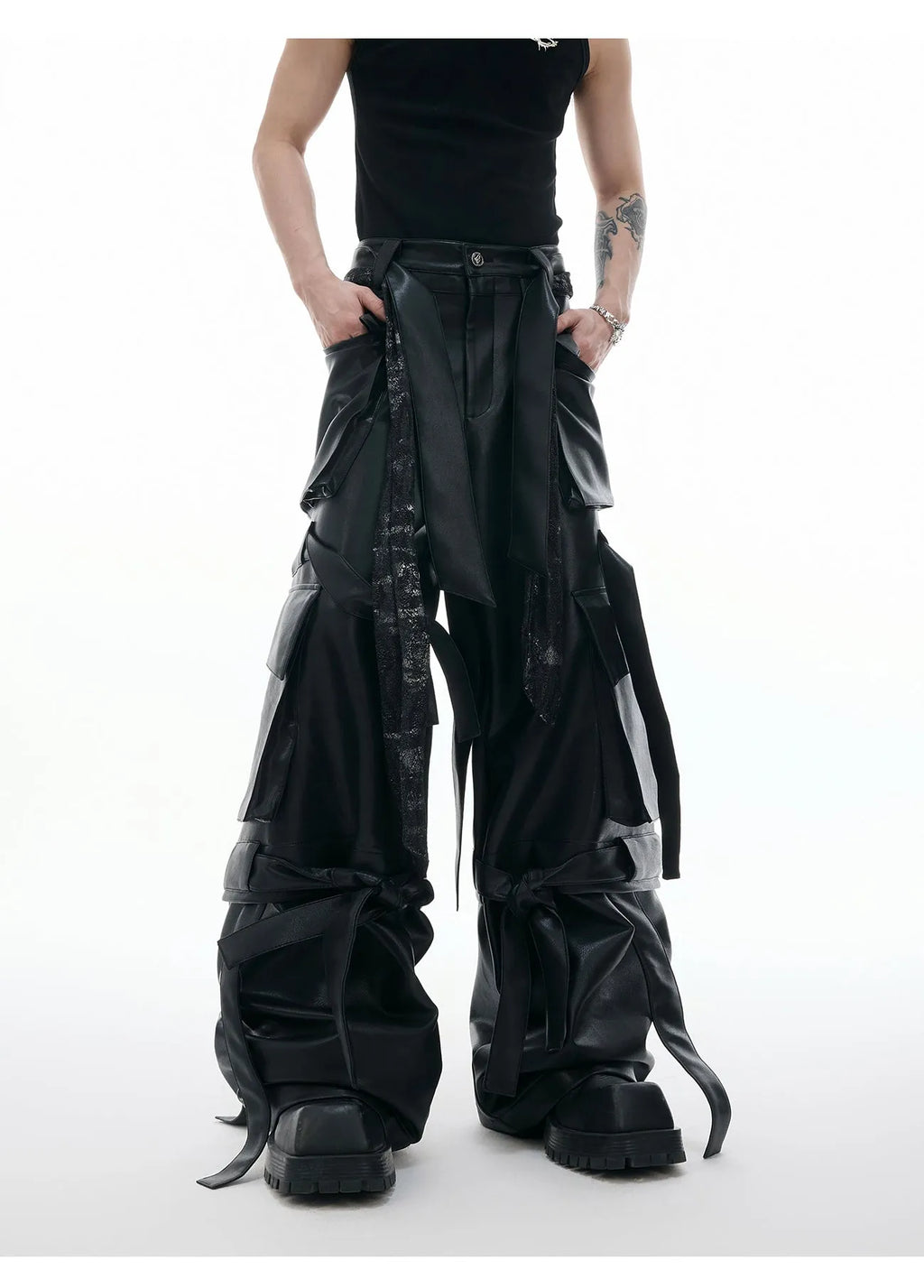 Black loose-fit quilted trousers with multiple pockets on a mannequin.