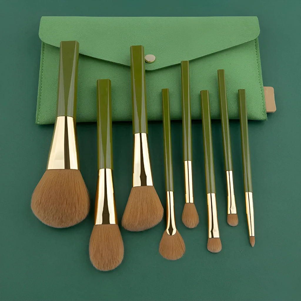 8-piece makeup brush set with man-made fibre bristles, wood handles, 17cm total length, and green shimmering PU bag